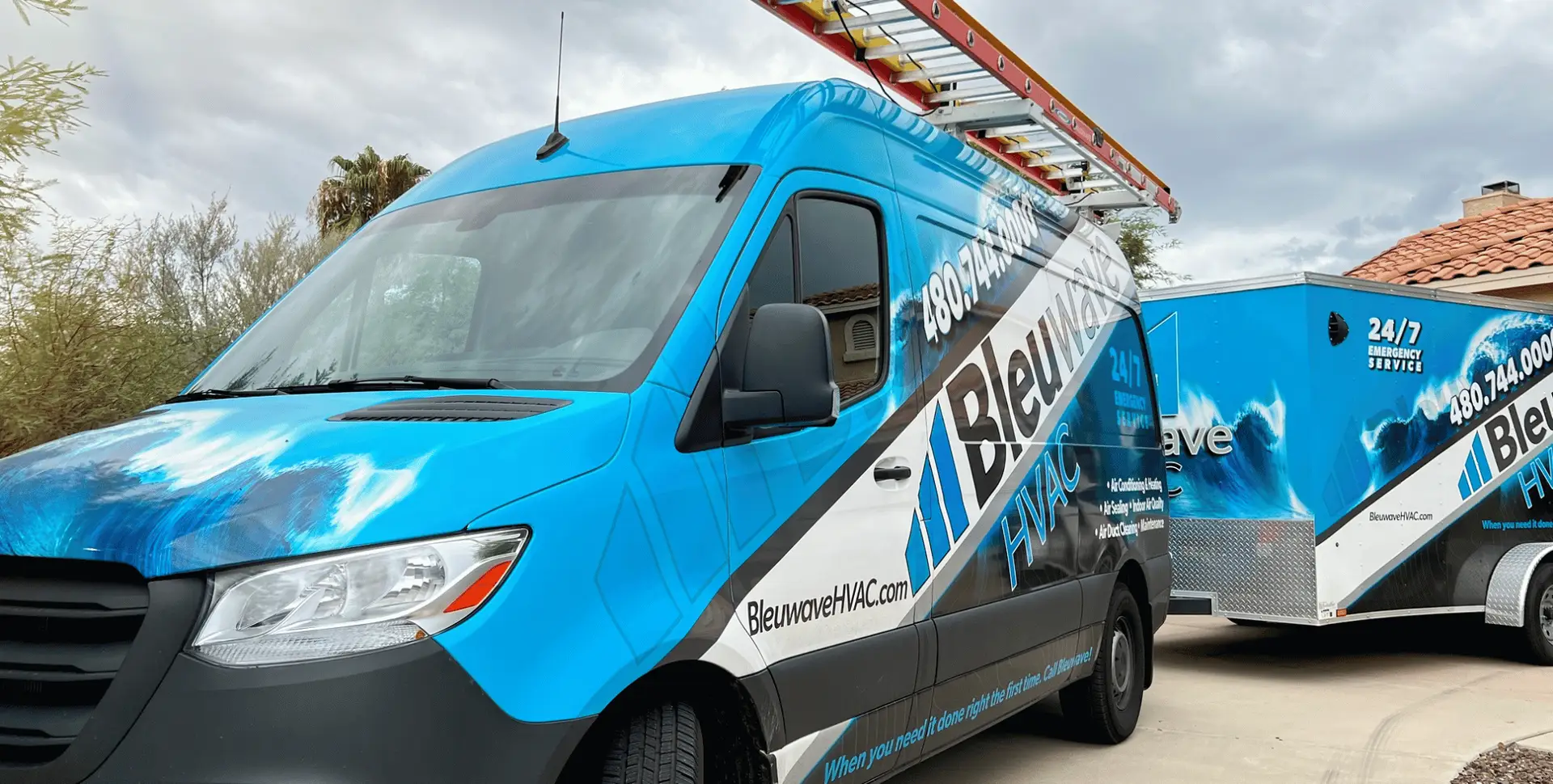 Bleuwave HVAC service van and trailer in a Phoenix driveway